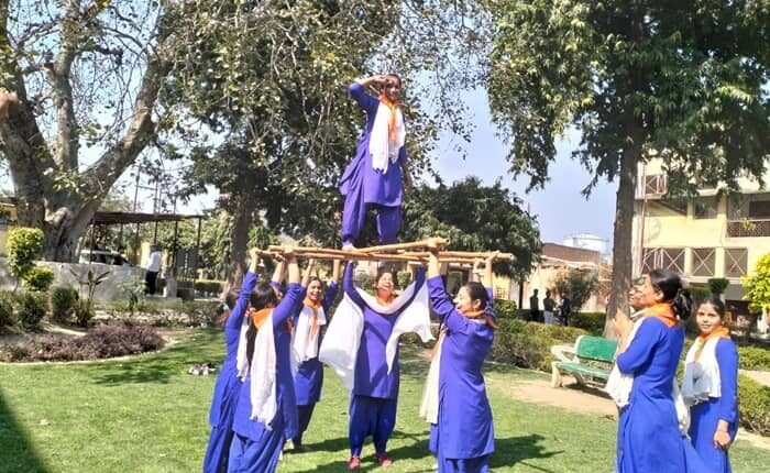 Information given about march past, good turn and construction of pyramid towers in scout guide camp. ​