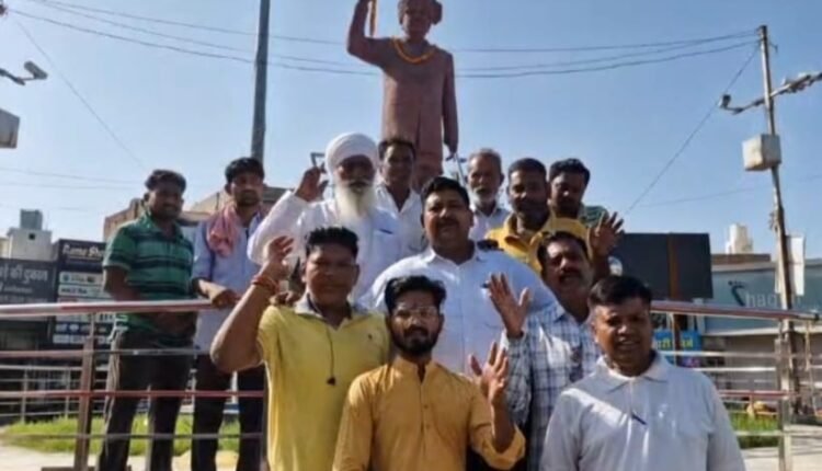 JJP officials garlanded Tau Devi Lal on his birth anniversary in Ellenabad.