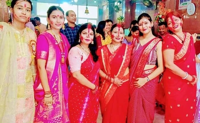 Women dressed in red on the auspicious occasion of Vijayadashami, a grand celebration of Sindoor Khela took place amidst the festive atmosphere.